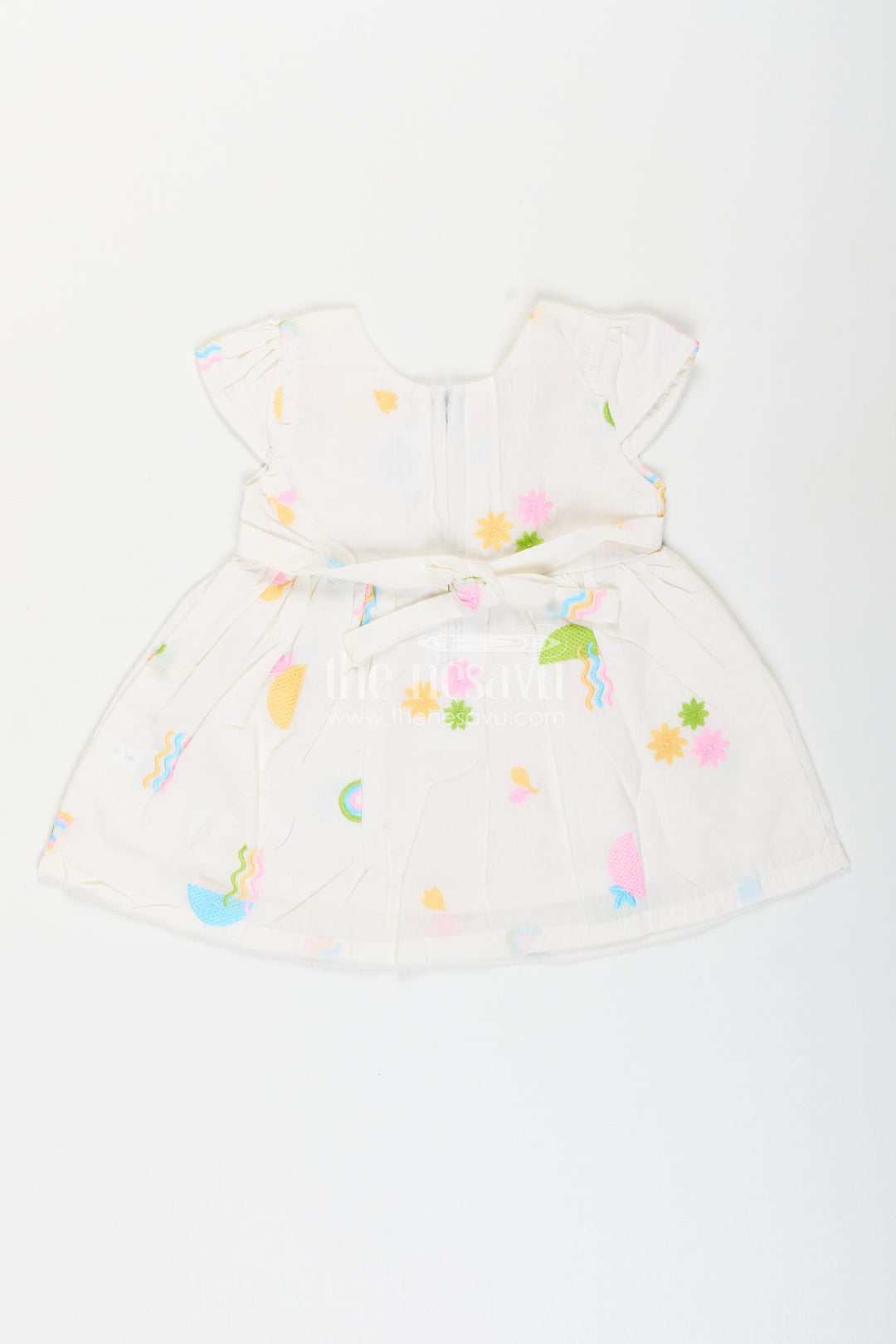 White baby girl frock with pastel embroidery for everyday wear