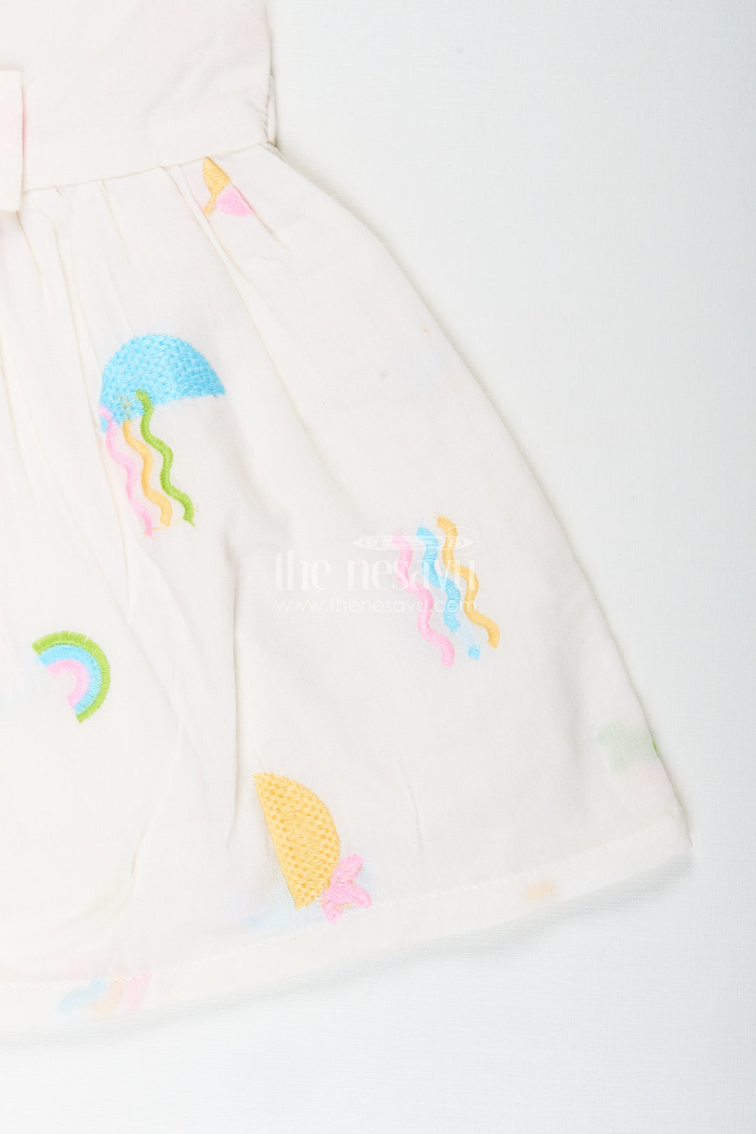White baby girl frock with pastel embroidery for everyday wear
