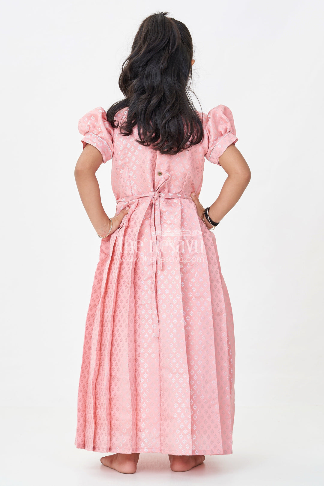 Girls Semi Banaras Silk Pink Party Wear Gown with Intricate Woven Motifs and Classic Puff Sleeves