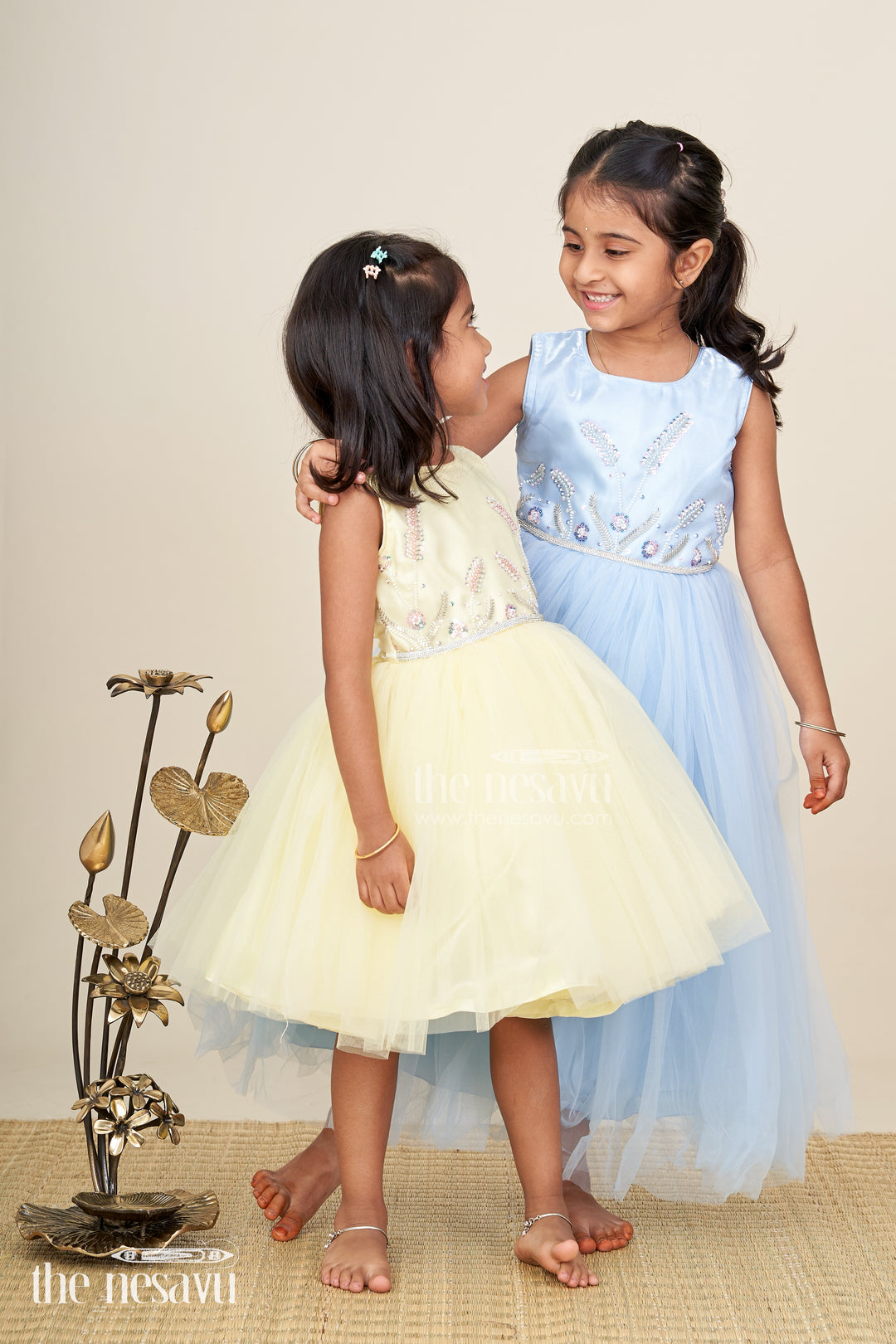 Satin party gown for girls with embroidered yoke and layered net skirt