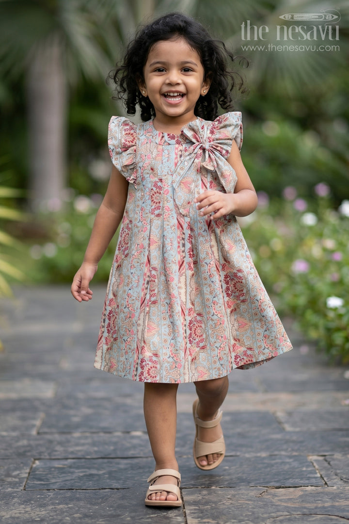 Girls Latest Frock in Muslin Silk with Intricate Print and Decorative Bow