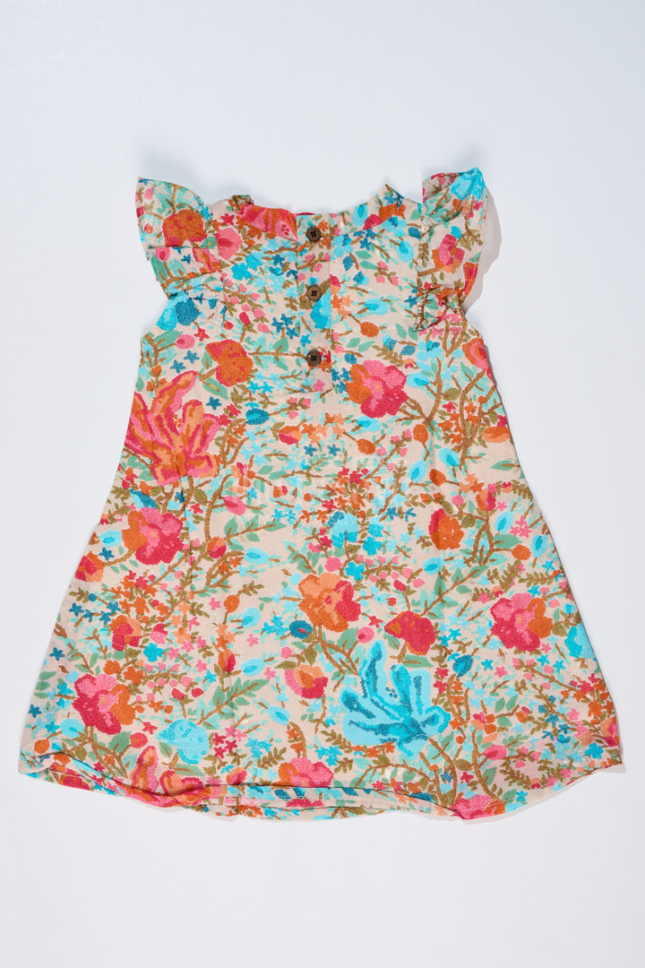 Girls Printed Frock in Muslin Silk with Vibrant Floral Patterns and Stylish Bow