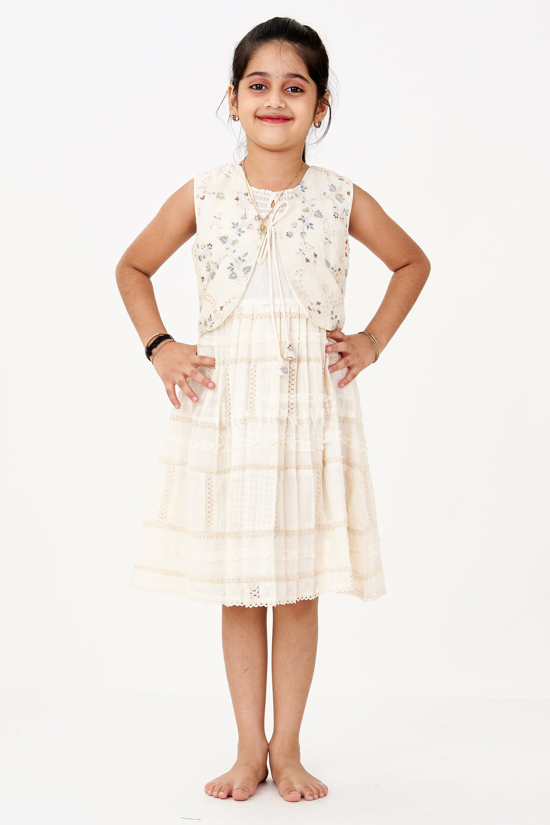 Girls White Color Frock with Embroidery and Layered Pleats for Graceful Festive Wear