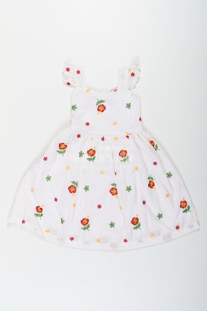 Girls White Floral Frock in Cotton Embroidery with Delicate Ruffles and Playful Design