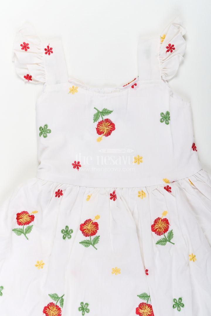 Girls White Floral Frock in Cotton Embroidery with Delicate Ruffles and Playful Design