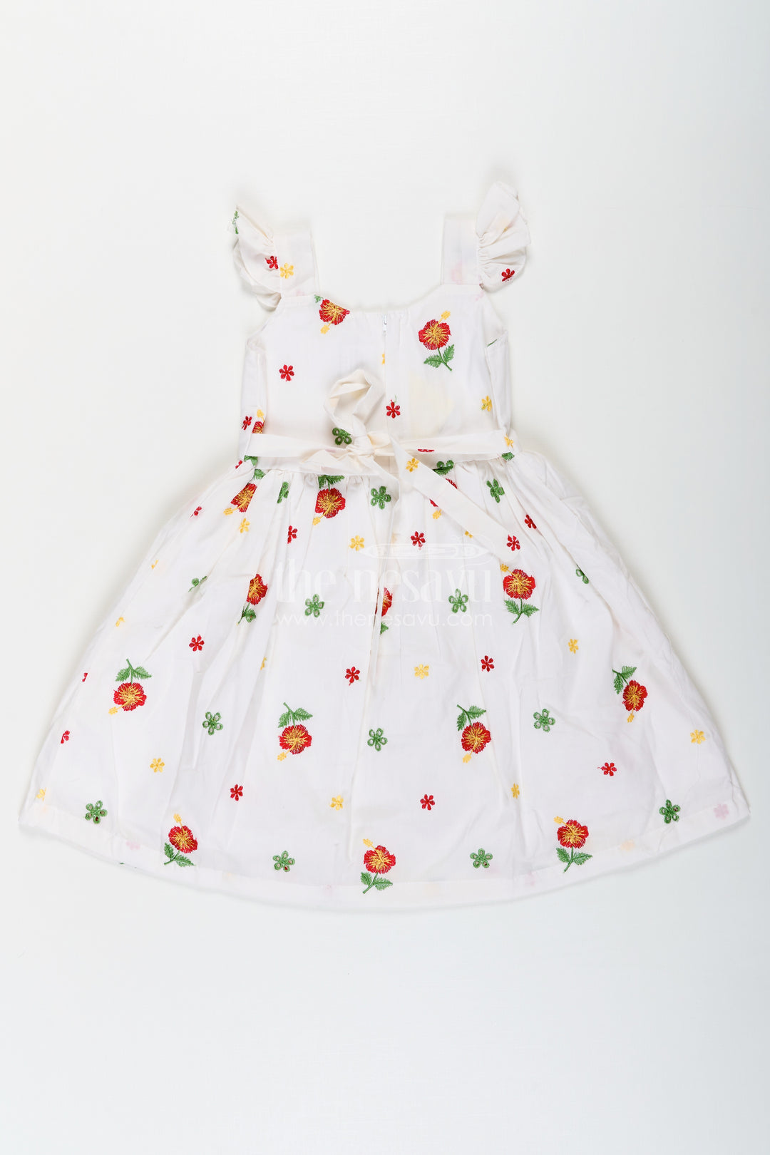 Girls White Floral Frock in Cotton Embroidery with Delicate Ruffles and Playful Design