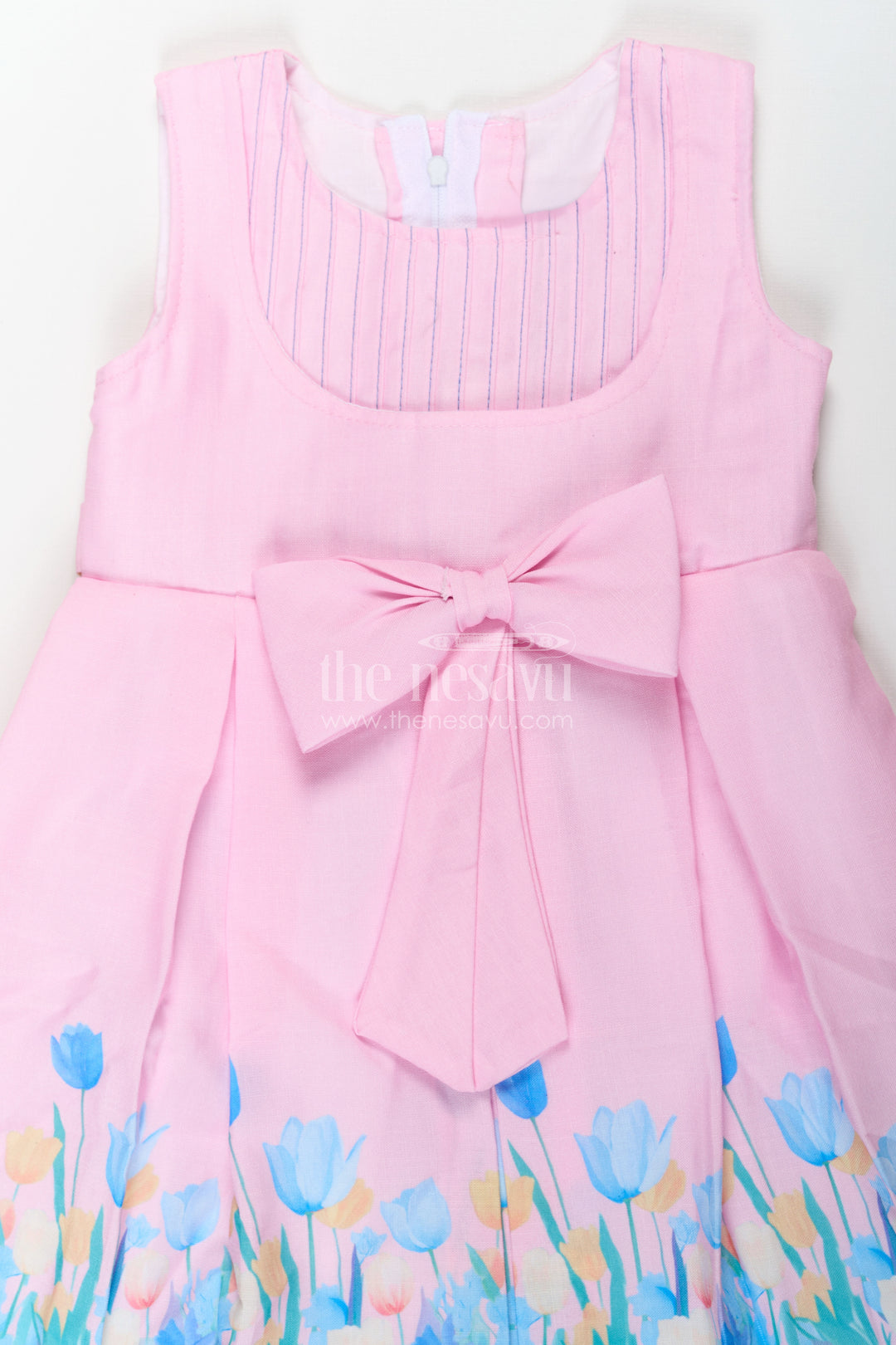 Girls Pink Colour Frock in Cotton Printed Fabric with Floral Border and Elegant Bow