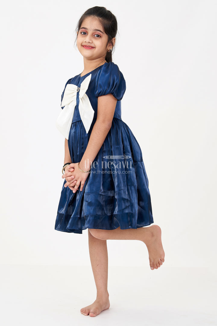 Girls Disney Princess Frock in Navy Blue Satin with Puff Sleeves and Large Ivory Bow Embellishment