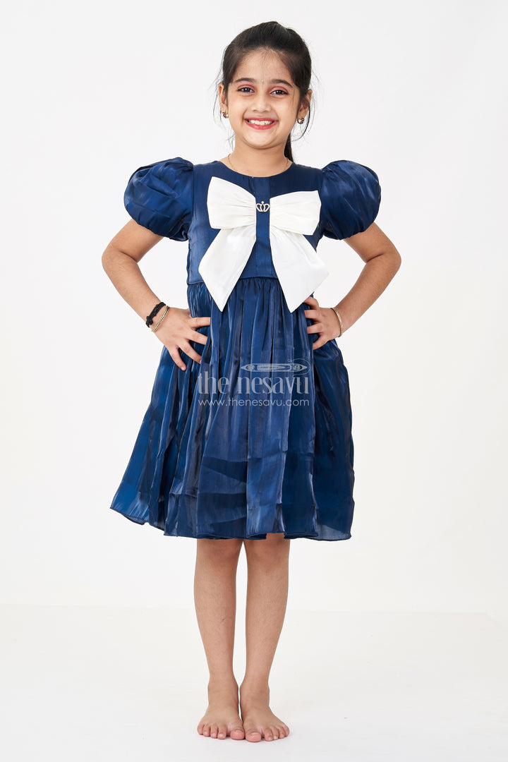 Girls Disney Princess Frock in Navy Blue Satin with Puff Sleeves and Large Ivory Bow Embellishment