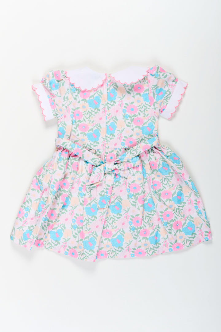 Girls Pink Flower Print Dress in Cotton with Embroidered Collar and Smocking for a Sweet Vintage Look