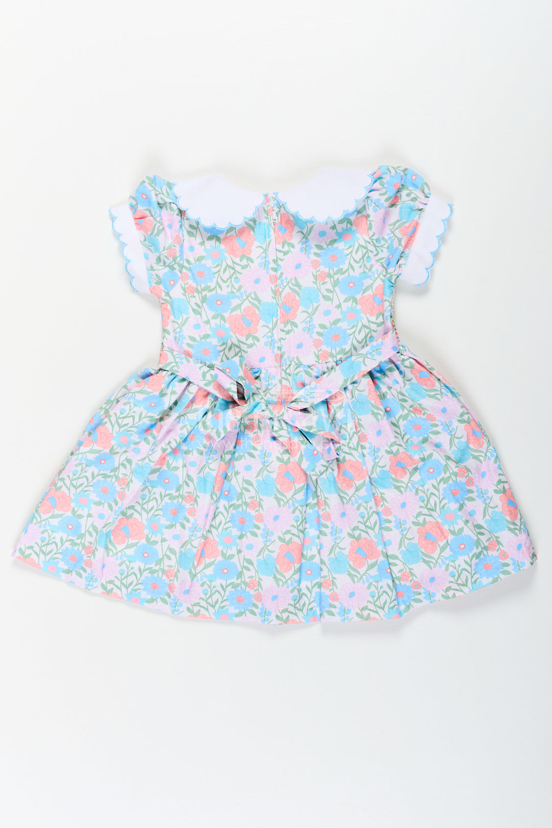 Girls Collar Frock Design in Floral Cotton with Smocked Bodice and Embroidered Collar for a Playful Yet Polished Look