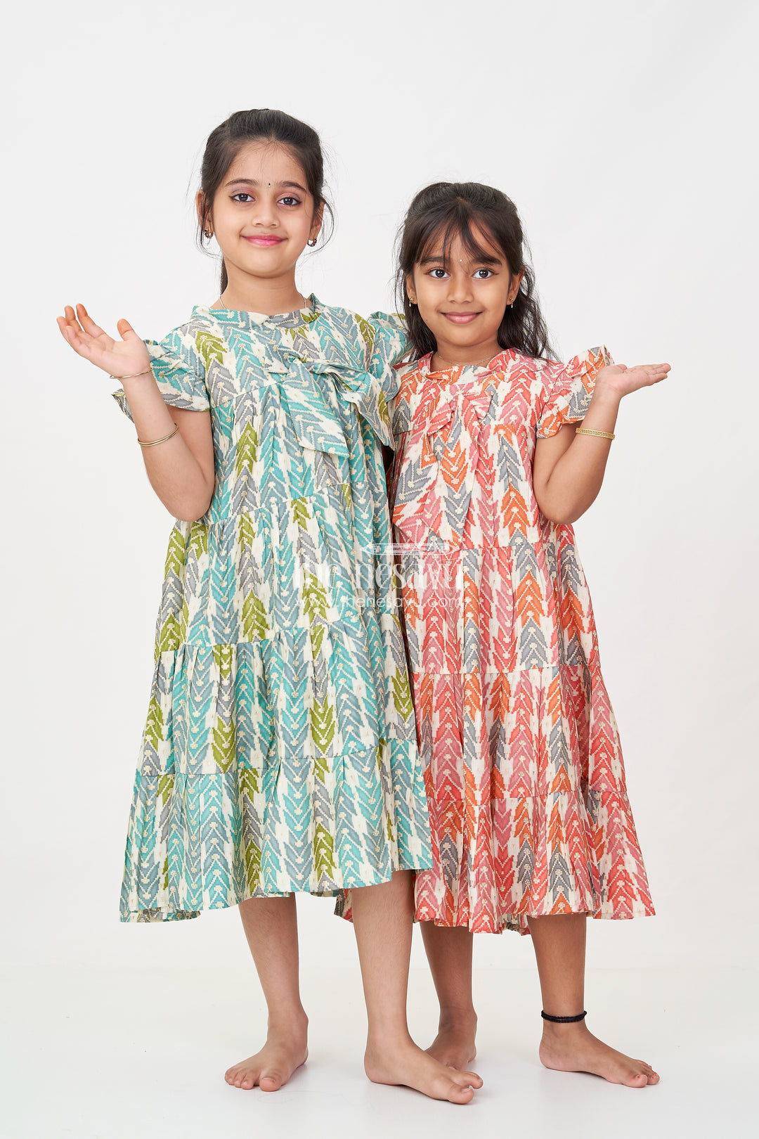 Green Colour Frock for Girls in Modal Silk with Multicolor Geometric Print and Front Bow Design