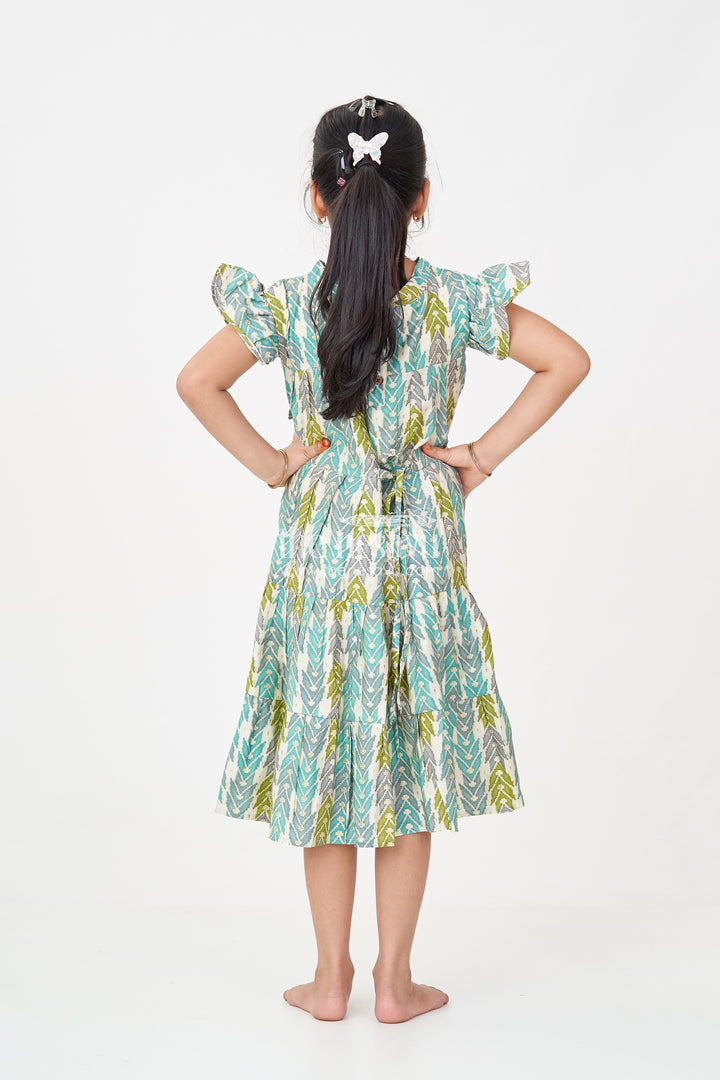 Green Colour Frock for Girls in Modal Silk with Multicolor Geometric Print and Front Bow Design