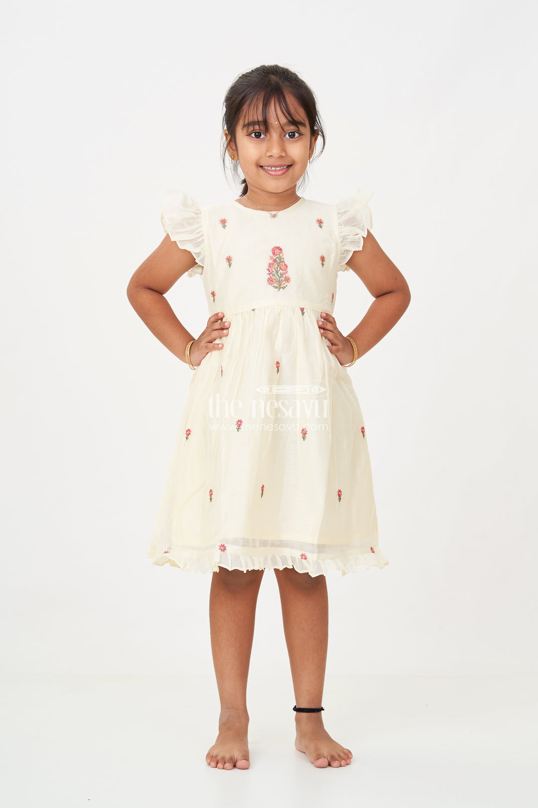 Designer Frocks for Girls in Light Yellow Chanderi with Delicate Red Floral Embroidery and Ruffled Sleeves