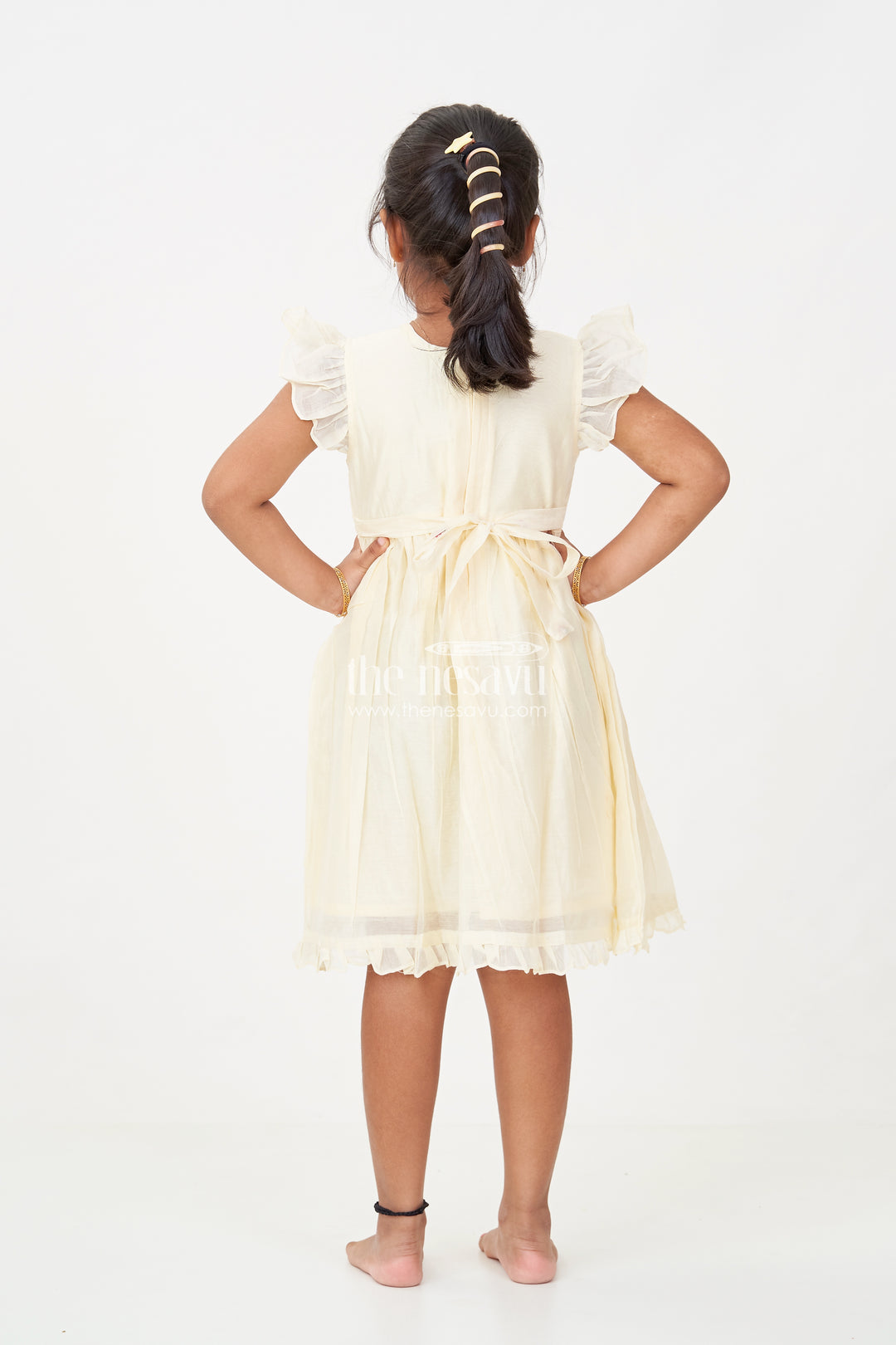 Designer Frocks for Girls in Light Yellow Chanderi with Delicate Red Floral Embroidery and Ruffled Sleeves