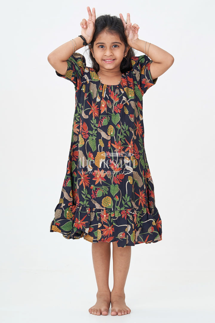Girls Cute Party Frocks in Black Modal Silk with Nature Inspired Digital Print and Ruffled Bottom