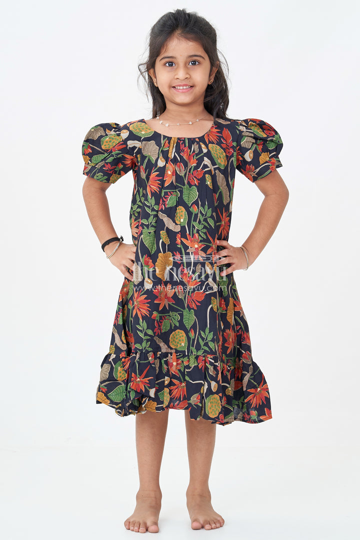 Girls Cute Party Frocks in Black Modal Silk with Nature Inspired Digital Print and Ruffled Bottom