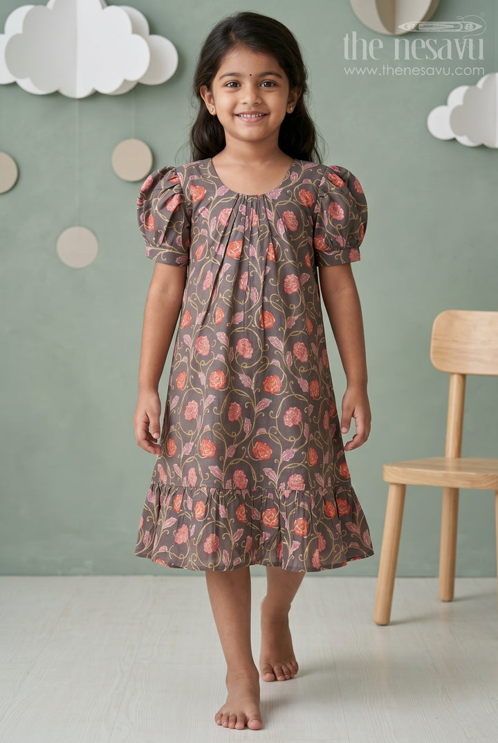 Girls Small Frock Design in Brown Muslin Silk with Red Floral Print and Flared Ruffle Hem