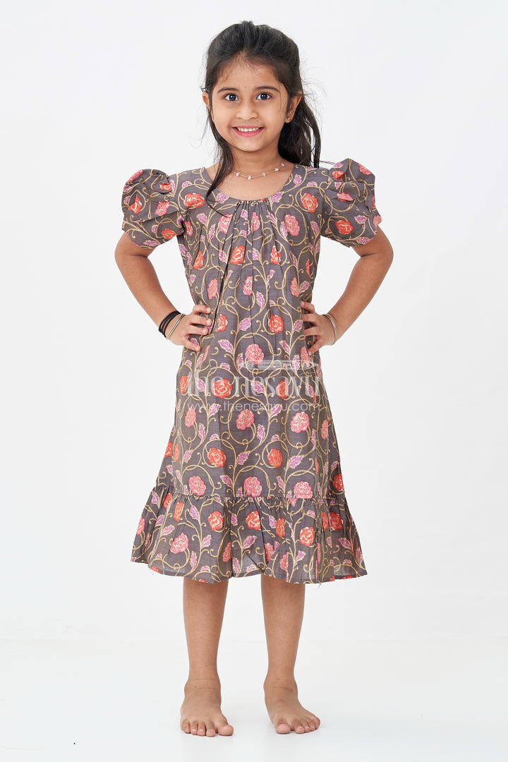 Girls Small Frock Design in Brown Muslin Silk with Red Floral Print and Flared Ruffle Hem