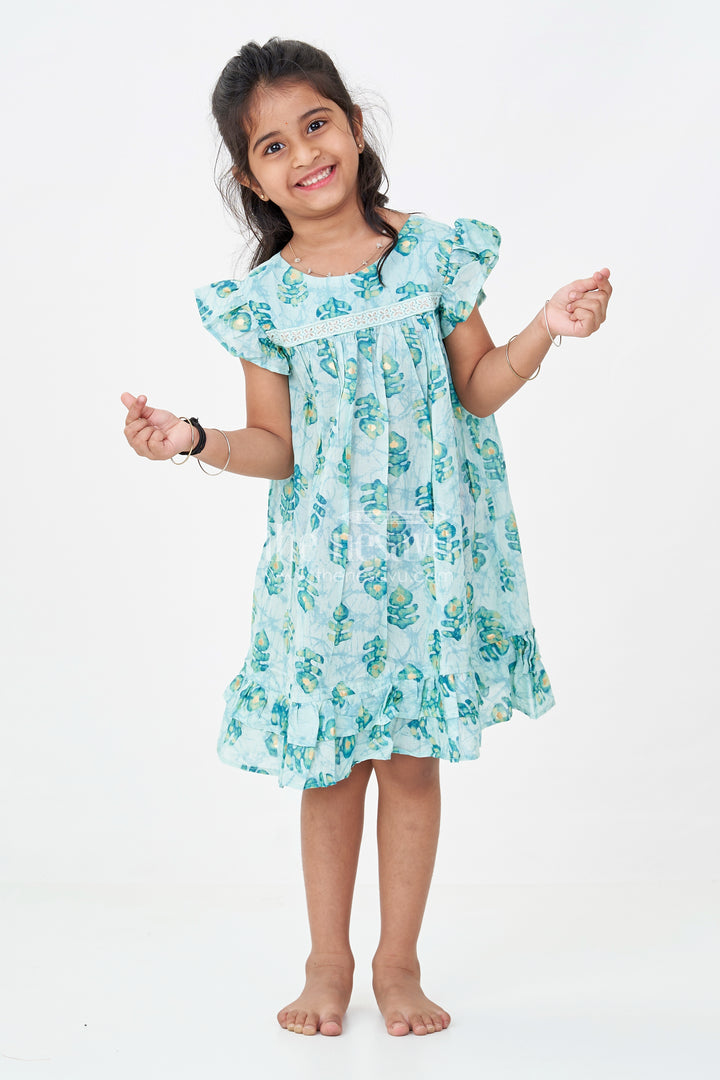 Girls Sky Blue Frock Design in Rayon with Leaf Motifs and Ruffle Accents for Whimsical Wear