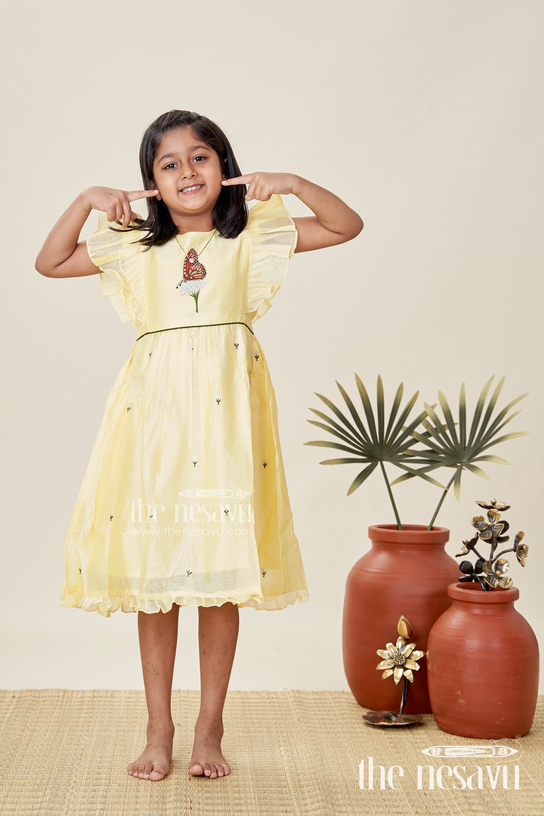 Girls Chanderi Cotton Beautiful Frock Design with Butterfly Embroidery and Ruffle Sleeves in Soft Yellow