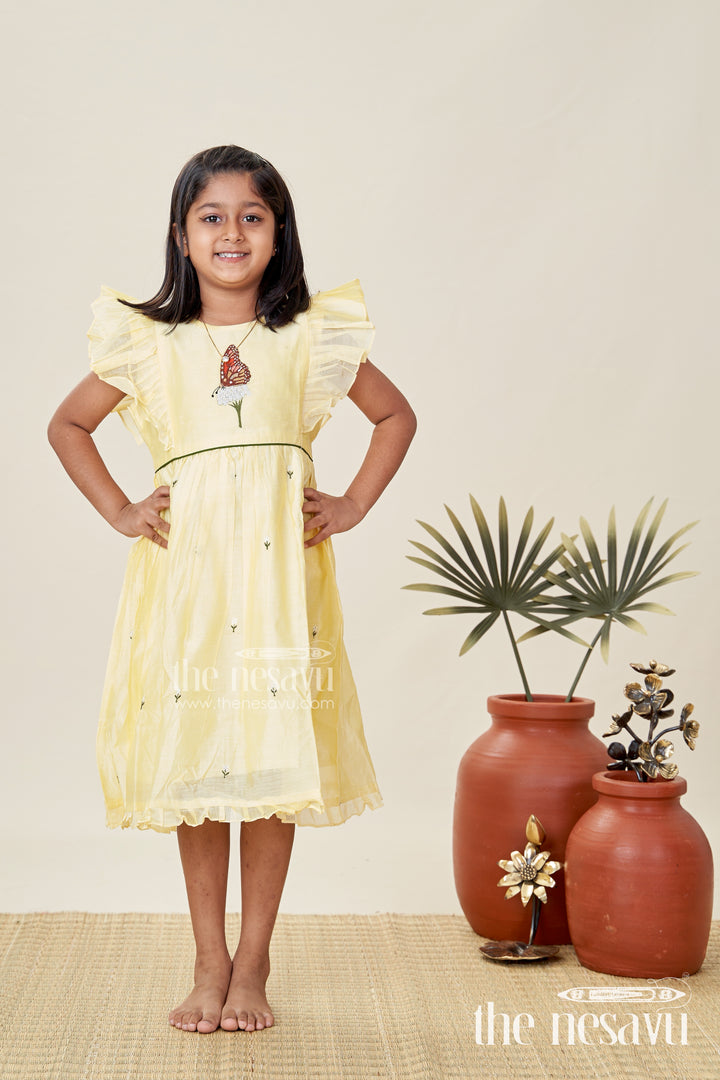 Girls Chanderi Cotton Beautiful Frock Design with Butterfly Embroidery and Ruffle Sleeves in Soft Yellow