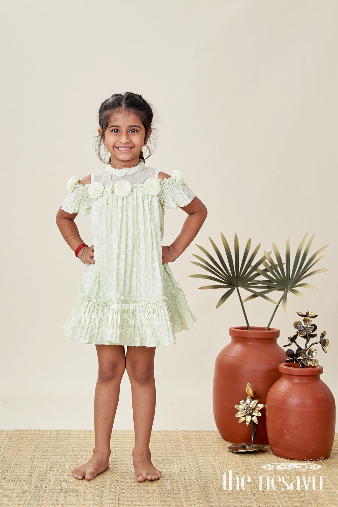 Girls Mini Organza Frock in Light Green with Crushed Texture and Floral Embellishments for Elegant Looks