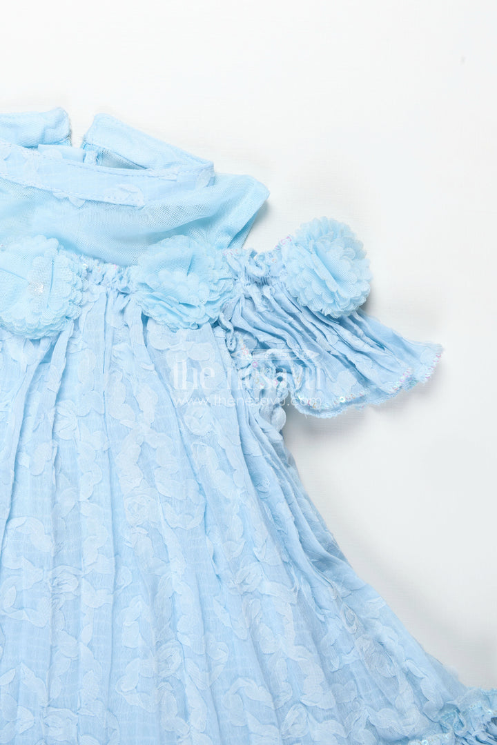 Girls Organza Frock Design 2025 in Sky Blue Crushed Fabric with Puff Sleeves and Delicate Flower Accents