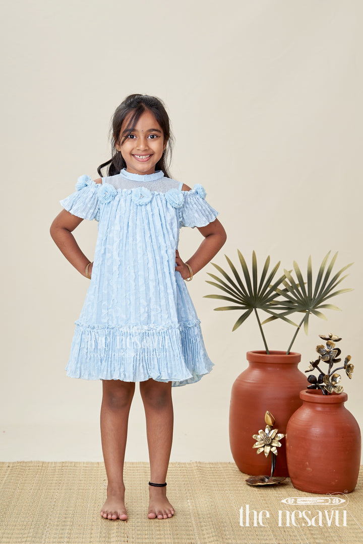 Girls Organza Frock Design 2025 in Sky Blue Crushed Fabric with Puff Sleeves and Delicate Flower Accents