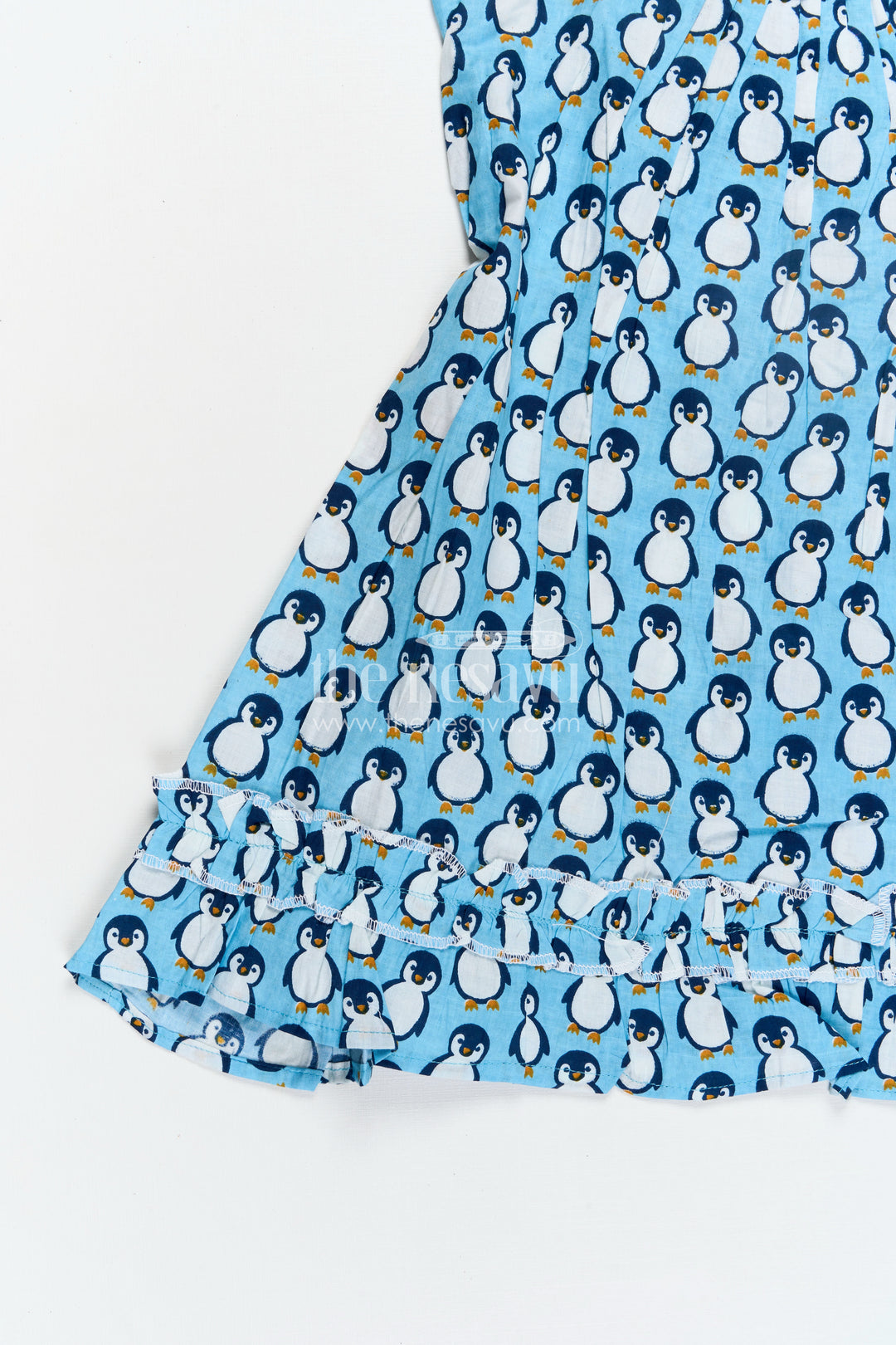 Girls Affordable Cotton Frock with Blue Penguin Hand Block Print and Frill Accents for Comfortable Wear