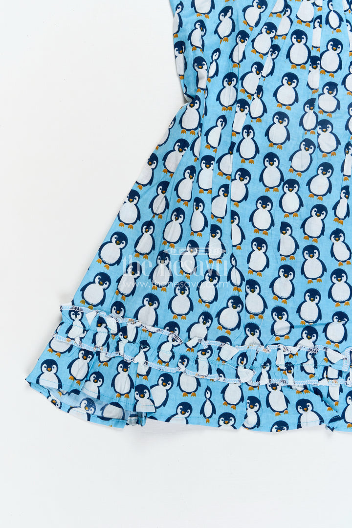 Girls Affordable Cotton Frock with Blue Penguin Hand Block Print and Frill Accents for Comfortable Wear