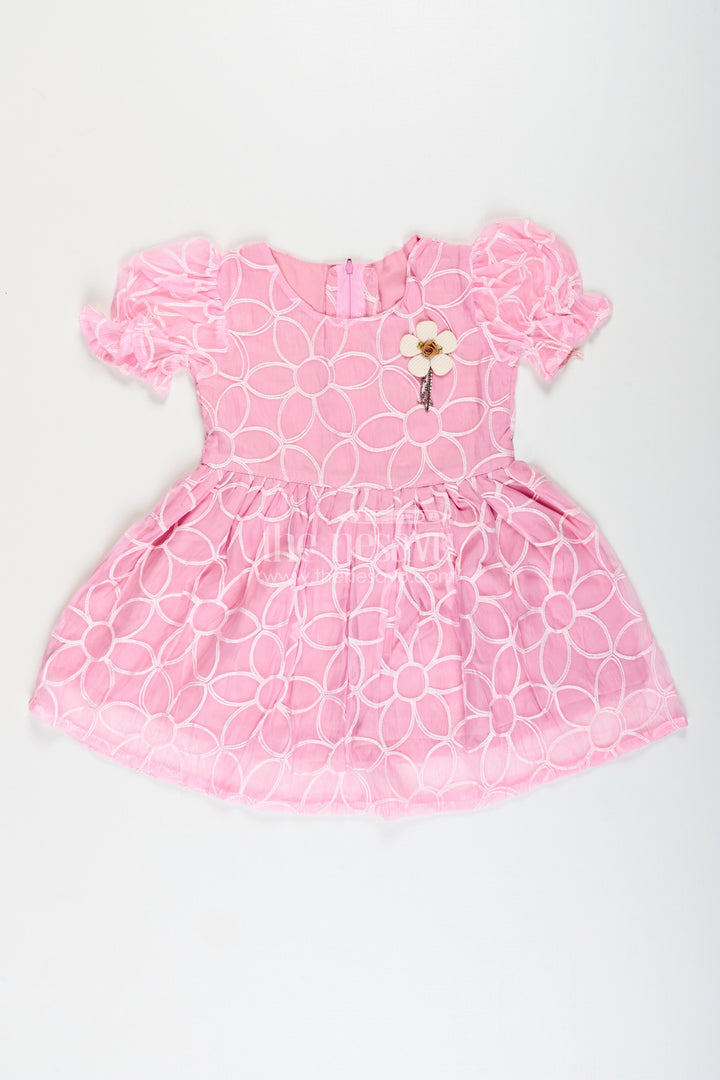 Girls pink embroidered organza frock with floral brooch for festive wear