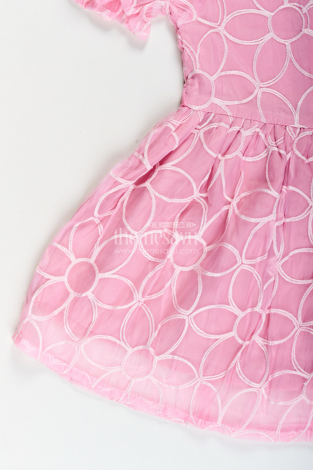 Girls pink embroidered organza frock with floral brooch for festive wear
