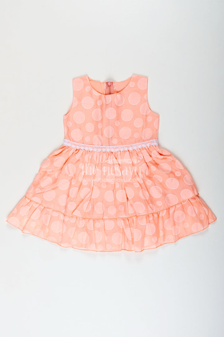 Girls peach georgette frock with polka dots for birthday and festive wear