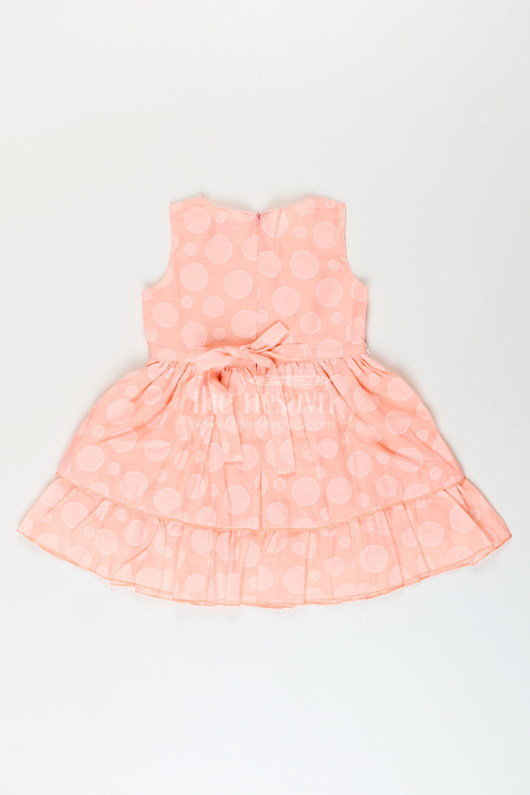 Girls peach georgette frock with polka dots for birthday and festive wear