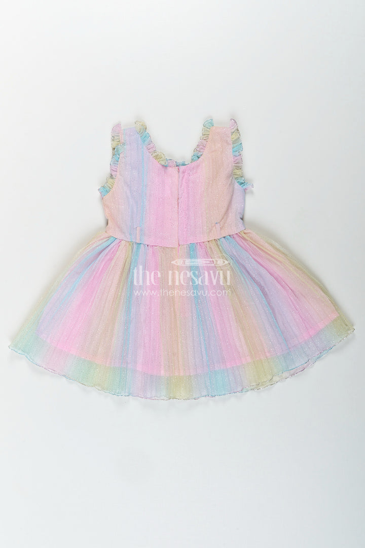 Rainbow pastel girls net frock with shimmer and flower brooch