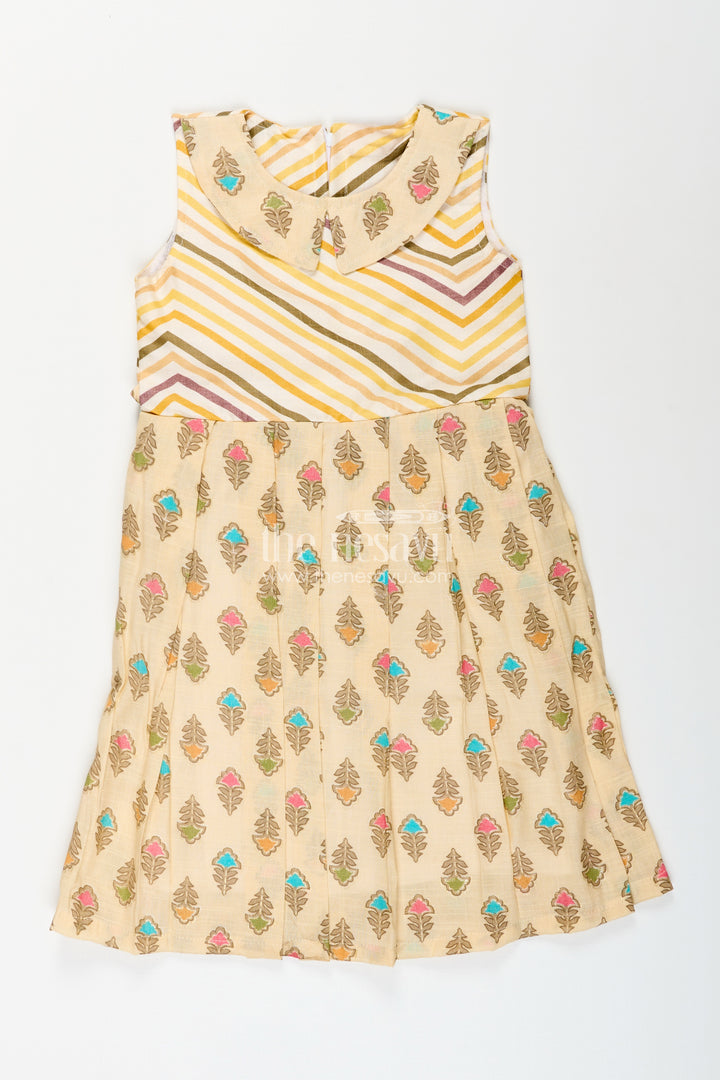 Girls cream frock with leaf block print and chevron stripes