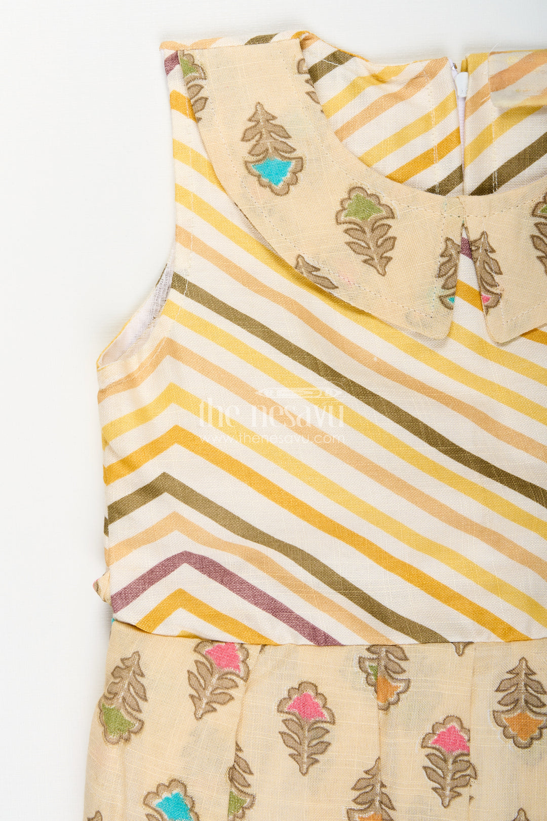 Girls cream frock with leaf block print and chevron stripes