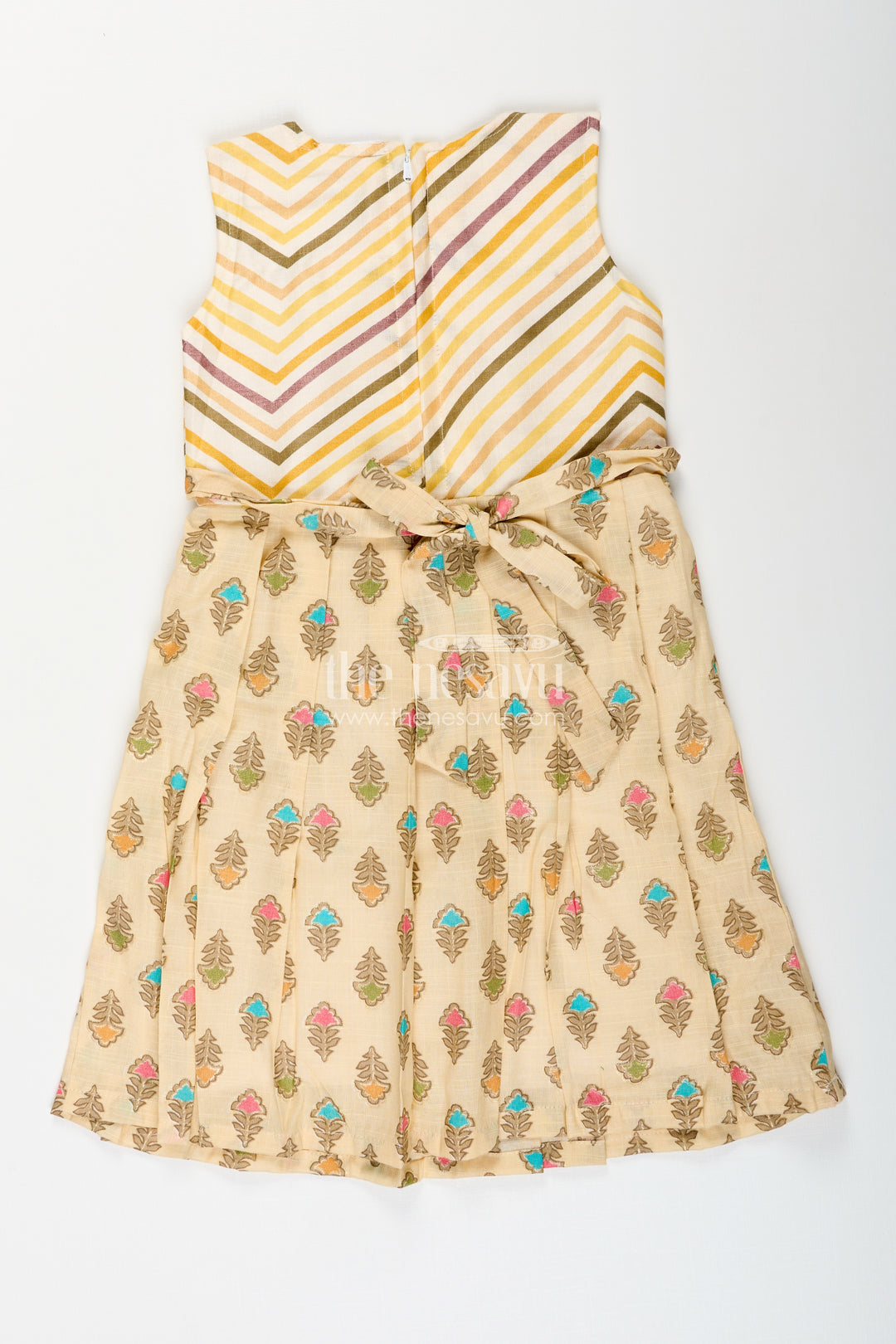 Girls cream frock with leaf block print and chevron stripes