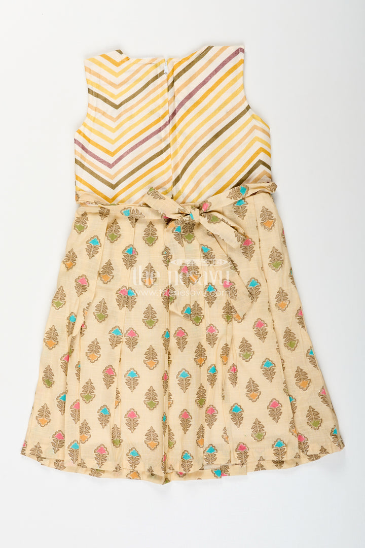 Girls cream frock with leaf block print and chevron stripes