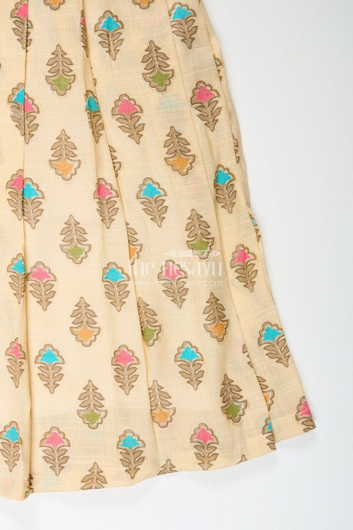Girls cream frock with leaf block print and chevron stripes
