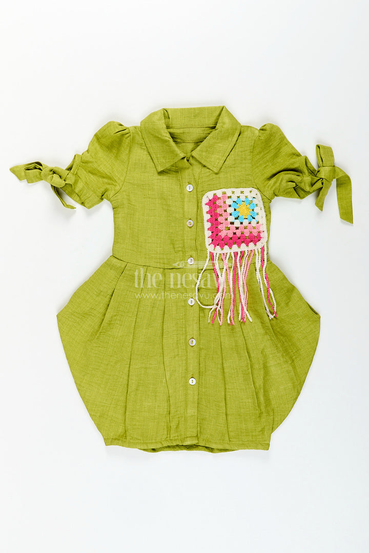 Green girls cotton frock with crochet patch and tie-up sleeves
