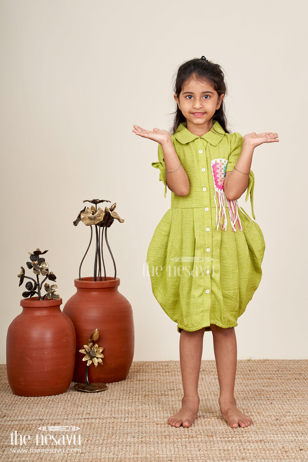 Green girls cotton frock with crochet patch and tie-up sleeves