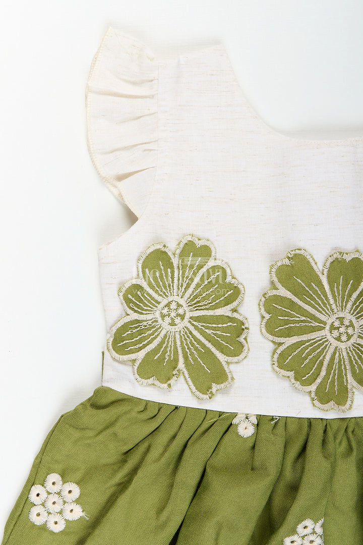 Green cotton frock for girls with white floral embroidery