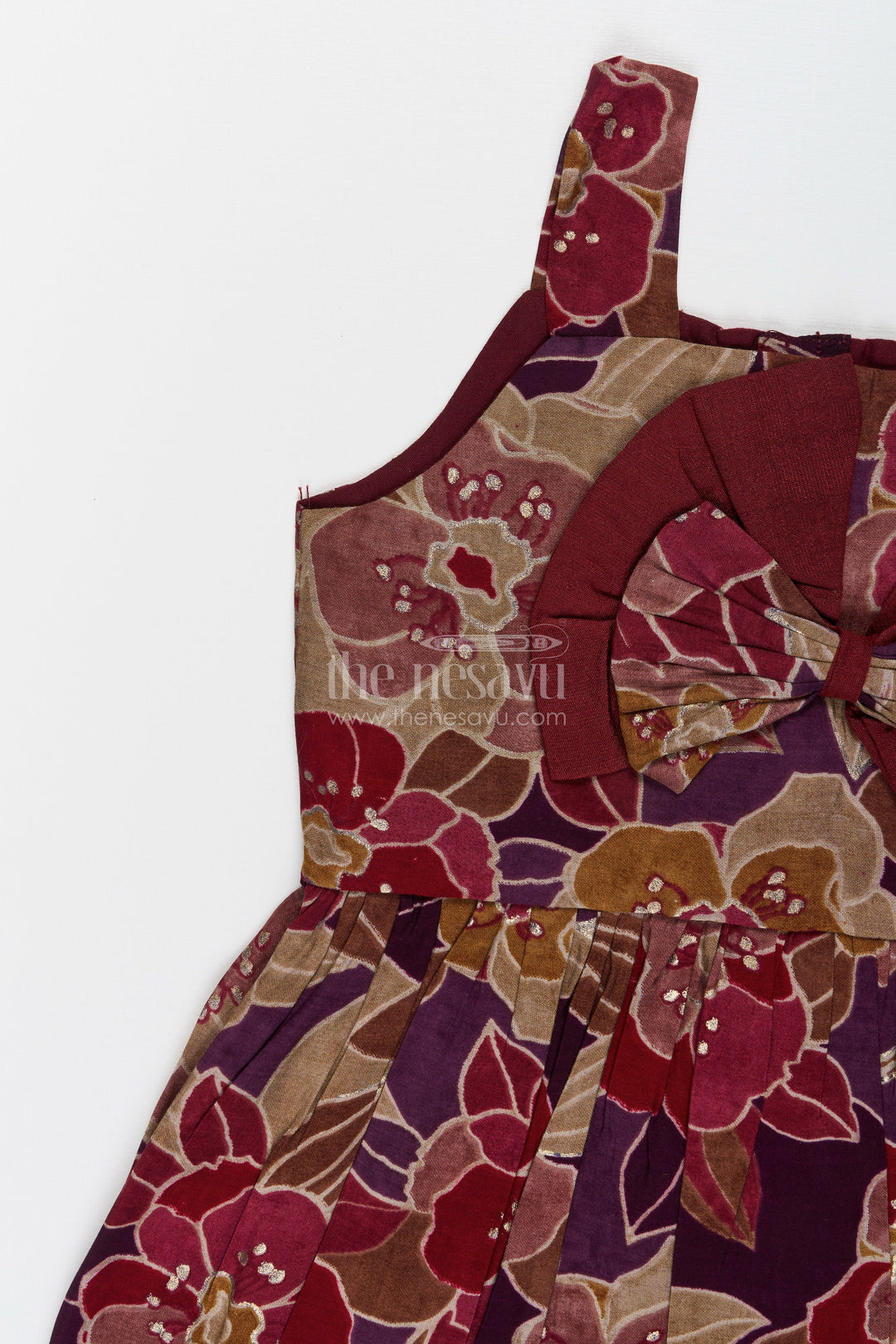 Party wear frock for toddler girls with bold floral print and bow detail