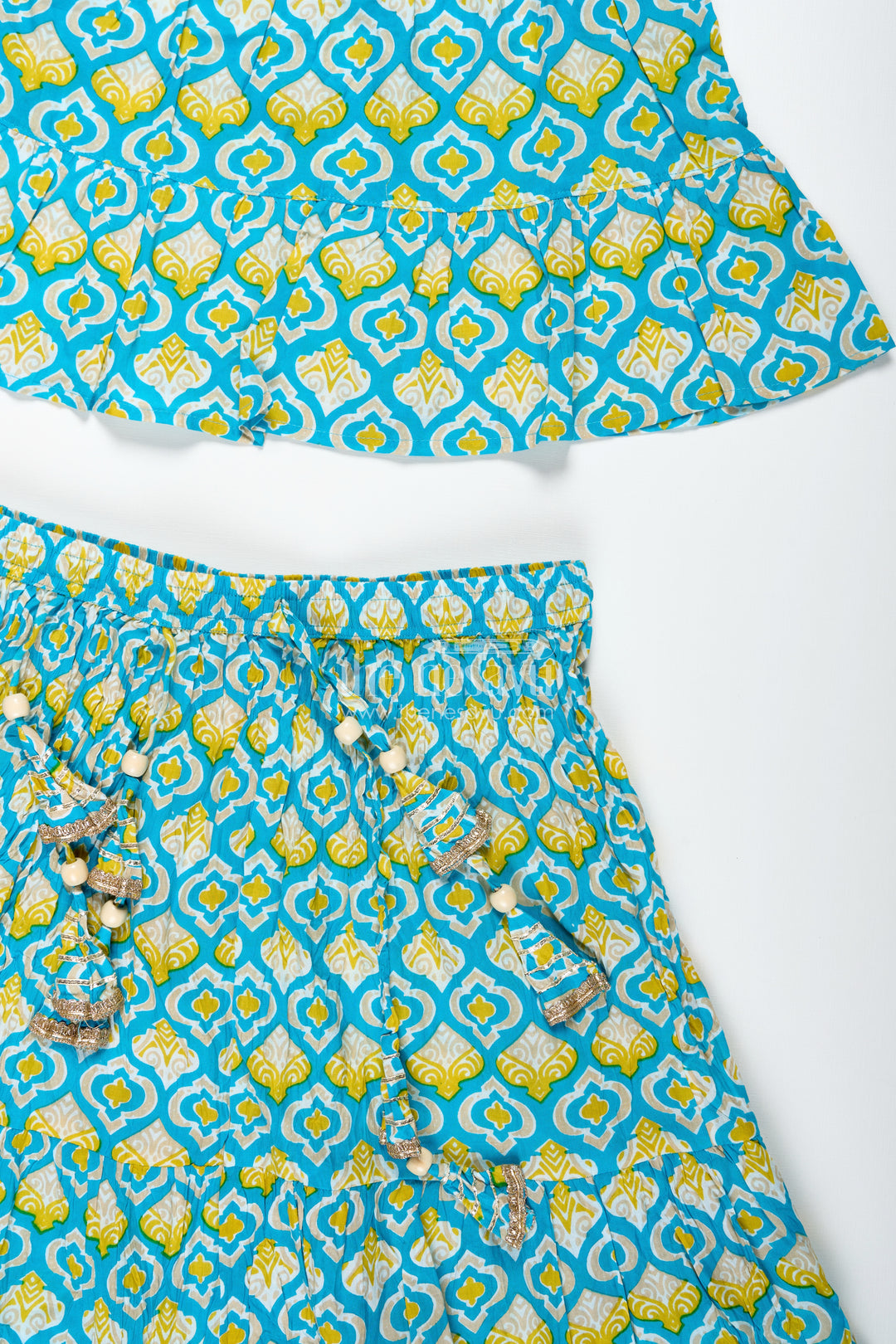 Girls Printed Cotton Lehenga Choli With Ruffle Hem And Tassel Belt