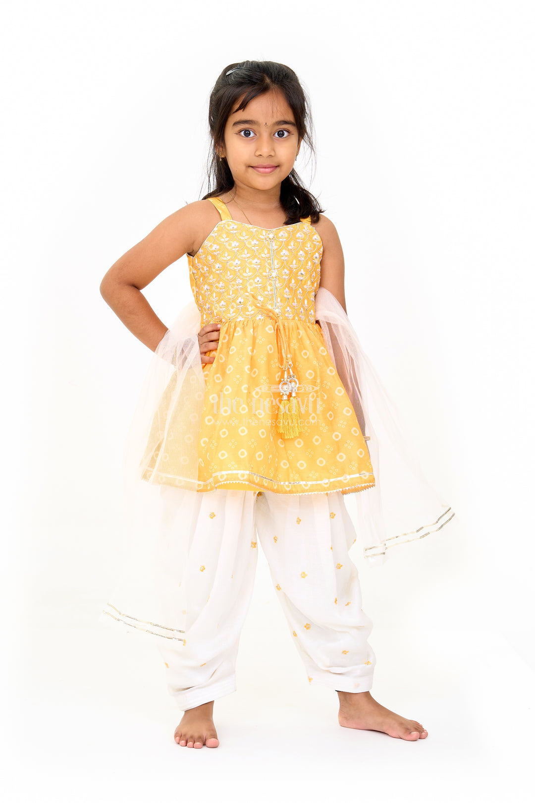 Girls Mustard Chinon Silk Peplum Set with White Dhoti Pants and Sleeveless Top for Festive Occasions