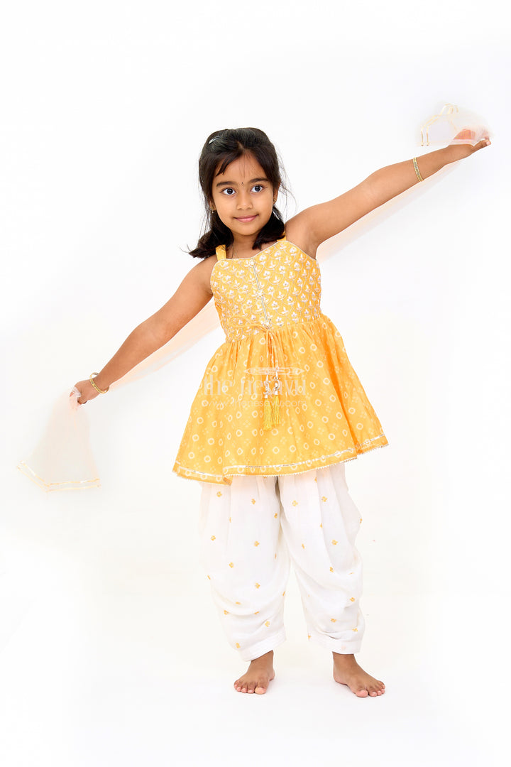 Girls Mustard Chinon Silk Peplum Set with White Dhoti Pants and Sleeveless Top for Festive Occasions