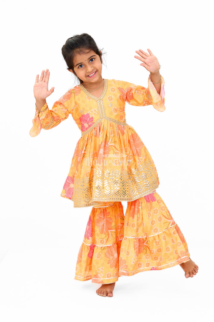 Girls Yellow Chinon Silk Sharara Set with Floral Print and Flared Sleeves for Festive Celebrations