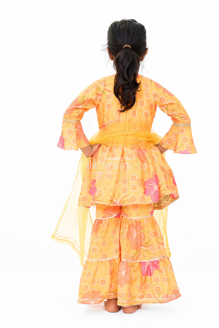 Girls Yellow Chinon Silk Sharara Set with Floral Print and Flared Sleeves for Festive Celebrations